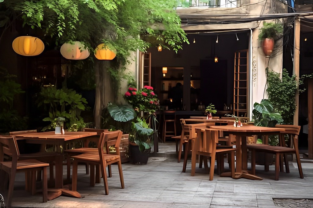 Thị cafe thiết kế quán cà phê đậm nét vintage bằng các lồng đèn rực rỡ treo trên tán cây của khoảng sân vườn nhỏ